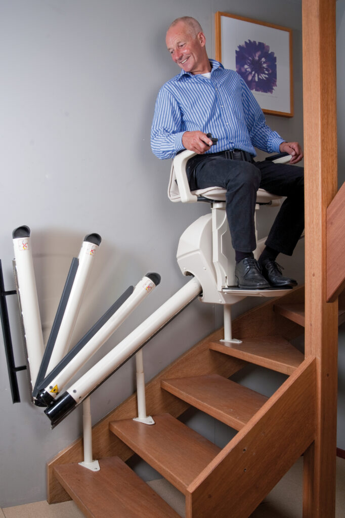 Mobility Scotland - Handicare Freecurve with automatic hinge folding track